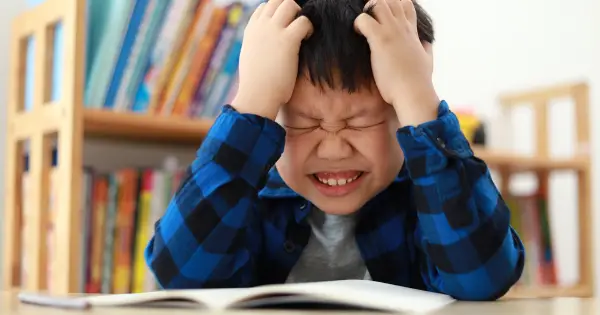 Child struggling with reading due to dyslexia