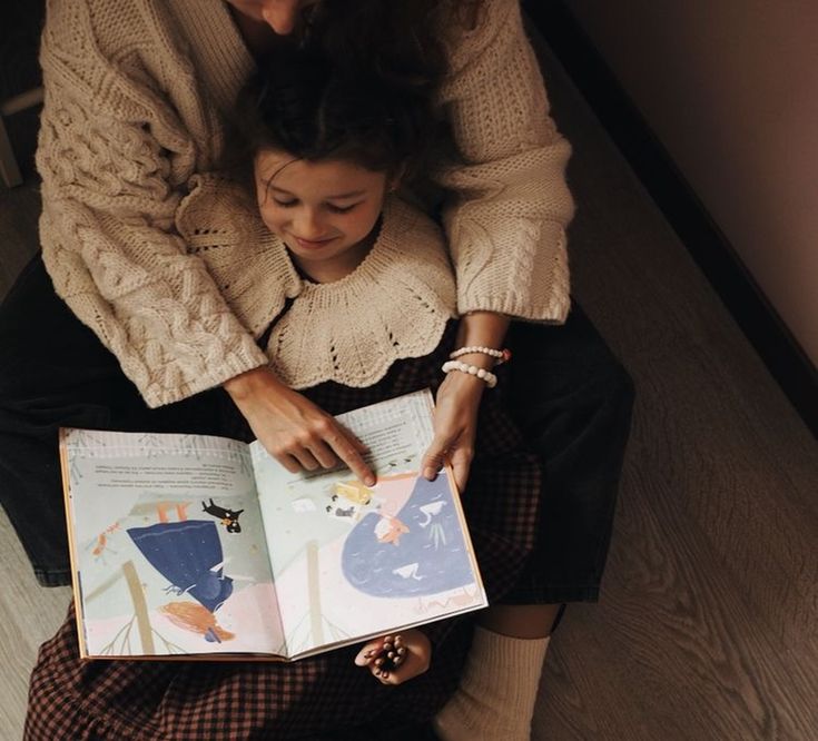 Child reading a colorful book